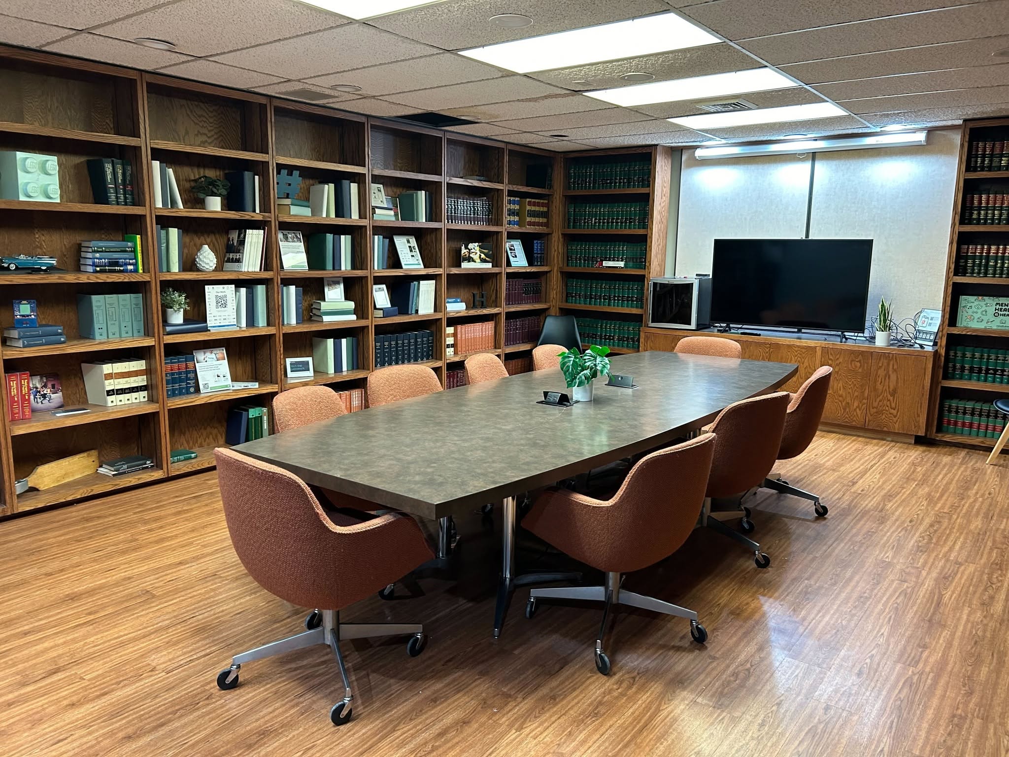 Library-style conference room with built-in bookshelves